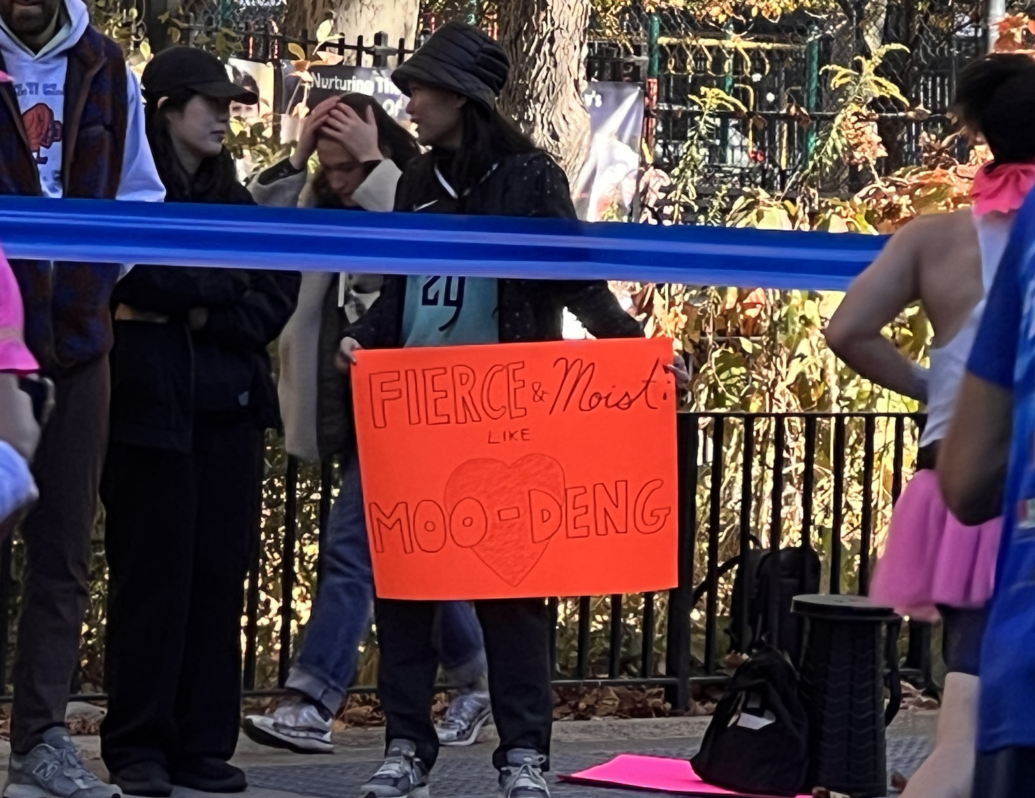 marathon attendee with a sign