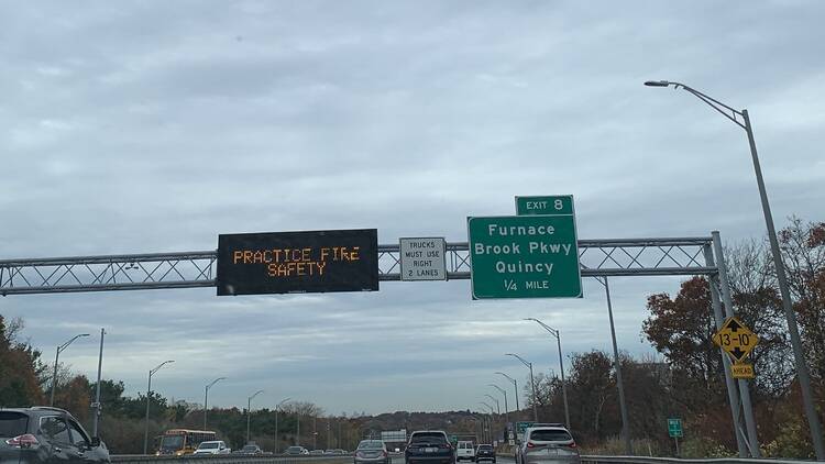 A sign on I-93 Sunday afternoon warned of wildfire risk in Massachusetts.