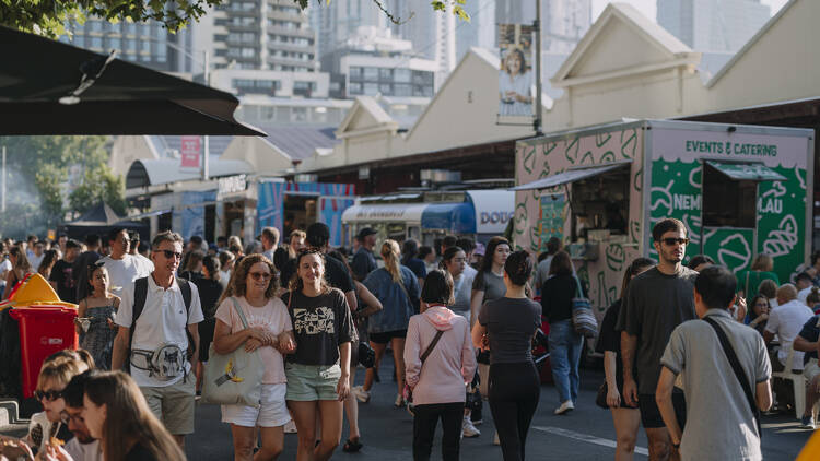 People wandering around the Queen Victoria Market.