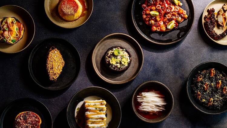 An overhead shot of Mexican food on a black table