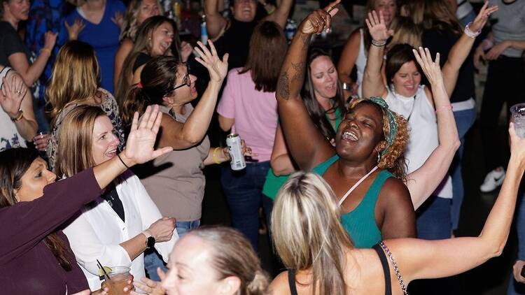 Women dance at a dance party.