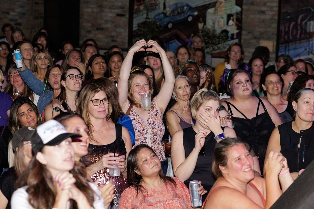 Women dance at a dance party.