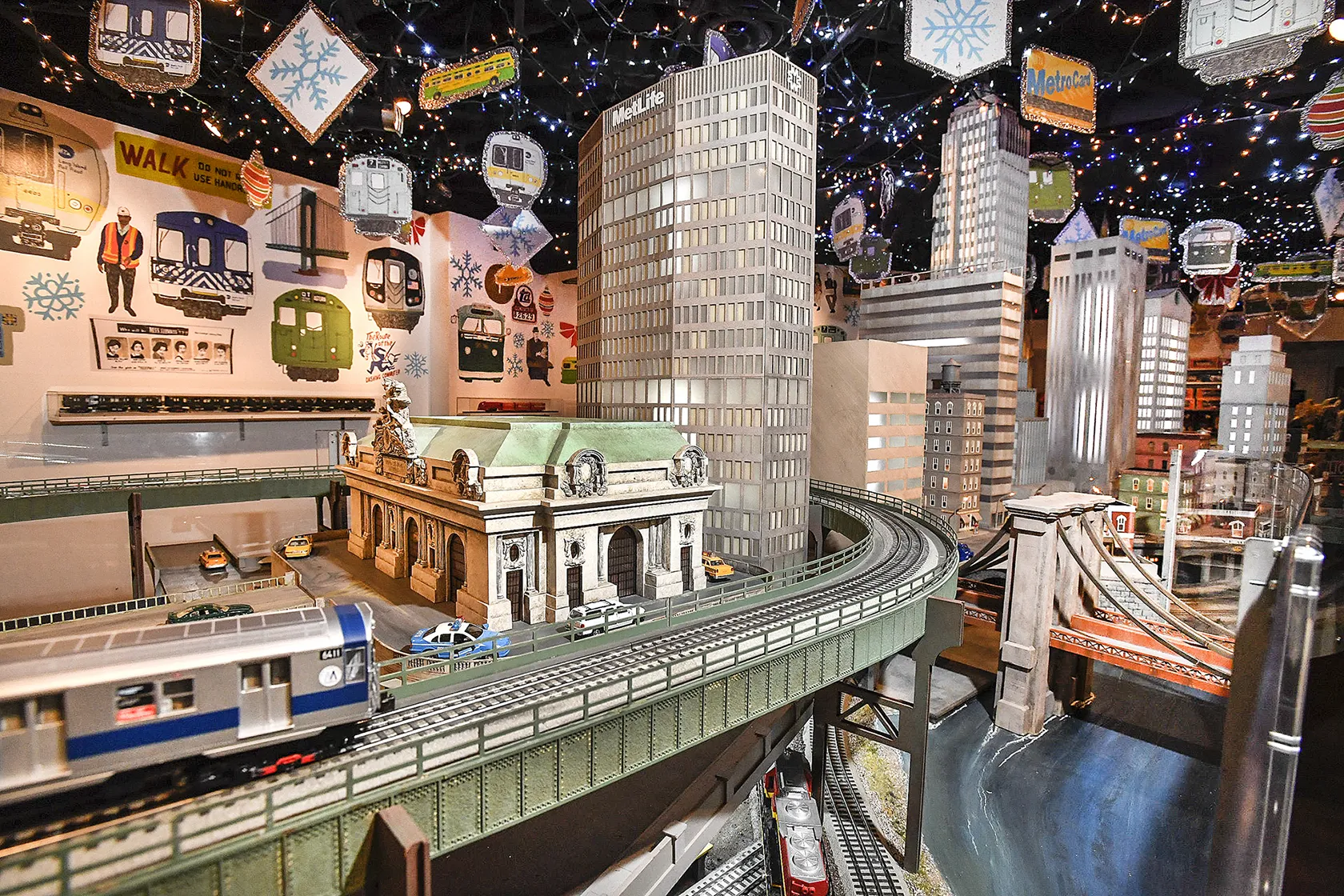 A train display with NYC buildings.