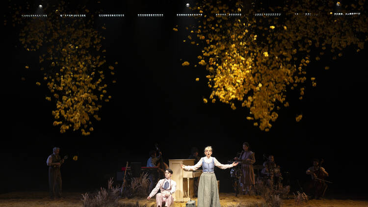 Members of the cast on a leafy stage as part of My Brilliant Career.