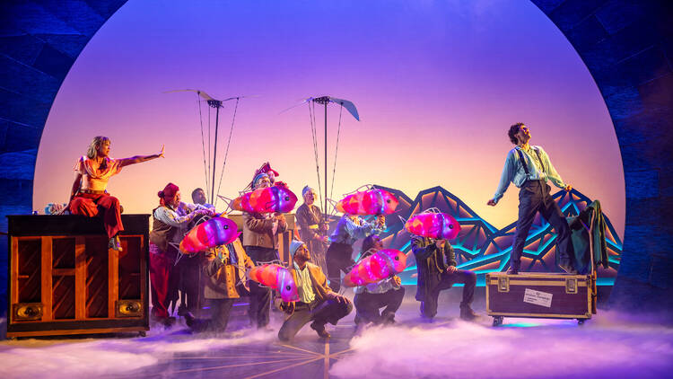 The cast of Peter and the Starcatcher on stage with puppets.