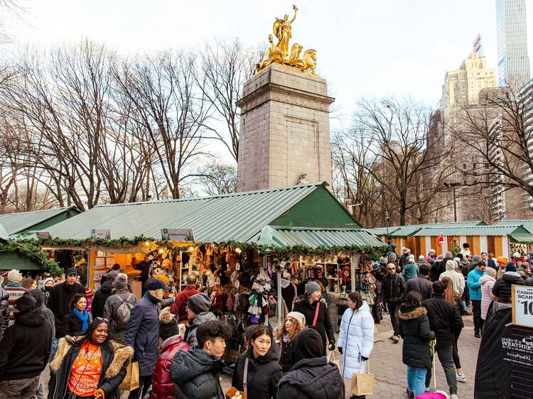 Shoppers peruse booths at the Columbus Circle Holiday Market.