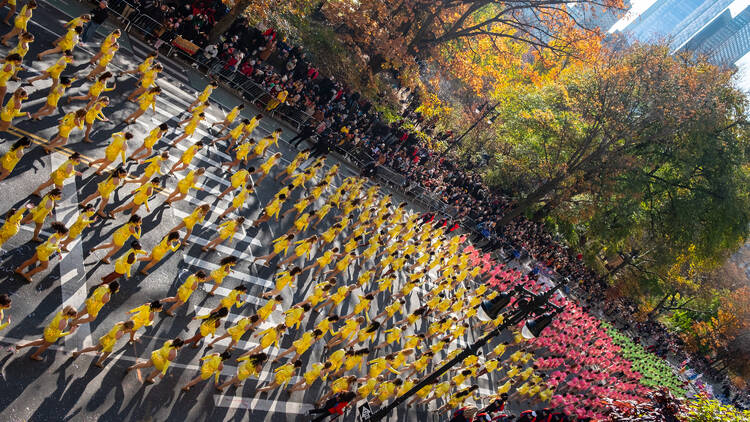 Cheerleaders march in the Macy's Thanksgiving Day Parade, 2021