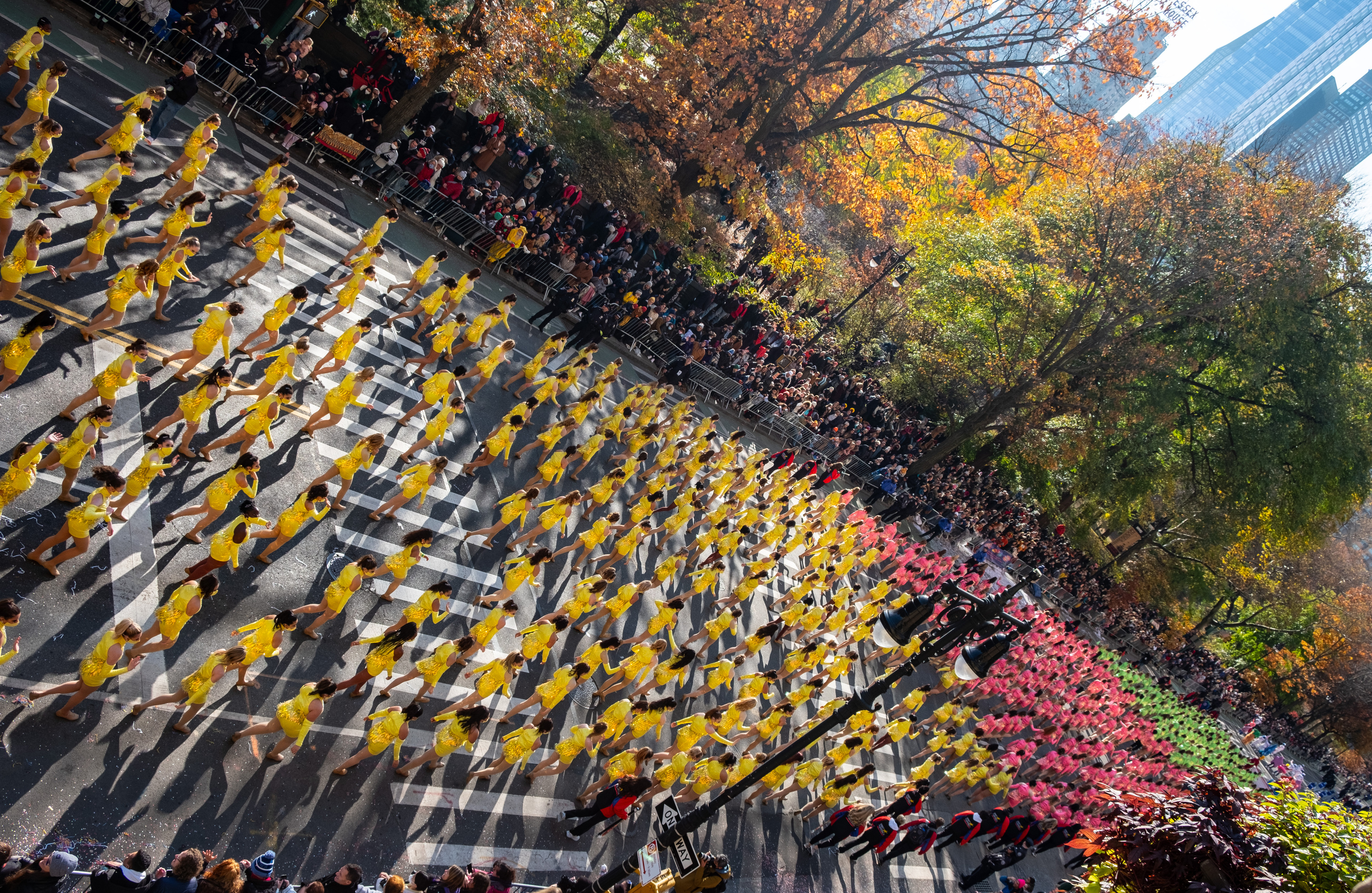 Cheerleaders march in the Macy's Thanksgiving Day Parade, 2021