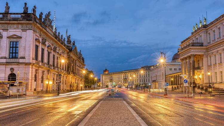 The famous Unter den Linden boulevard in Berlin with its historic buildings at night