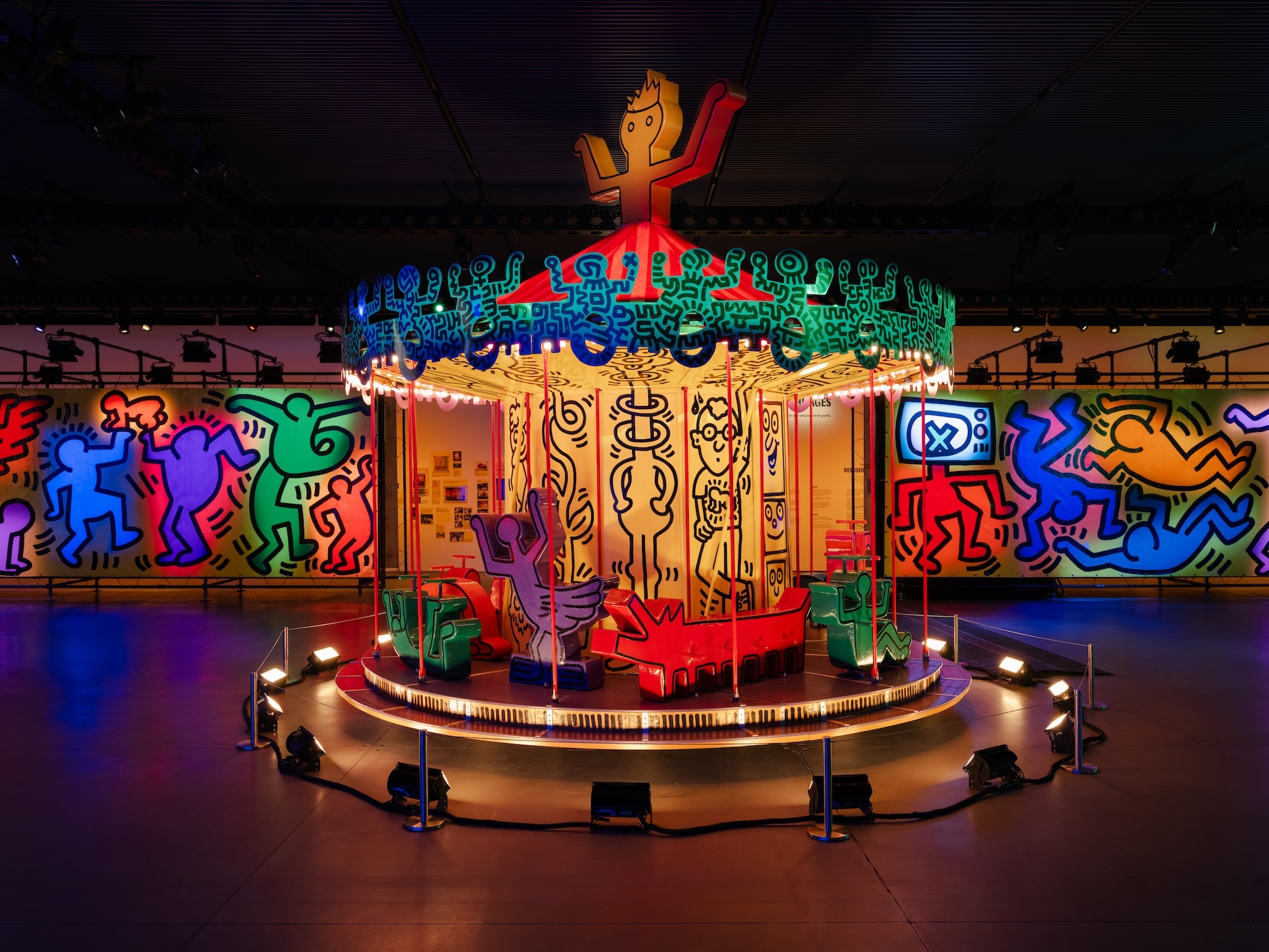 A merry-go-round in colorful designs by Keith Haring.