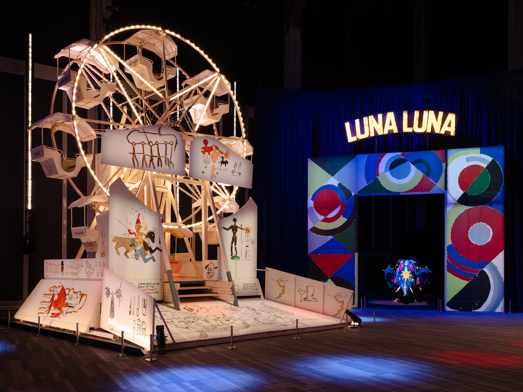 A large Ferris Wheel with designs by Jean-Michel Basquiat.