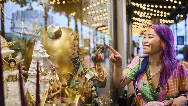 Woman looking at Christmas decorations