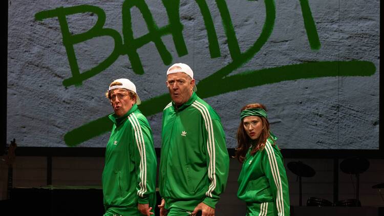 three actors dancing in green adidas tracksuits