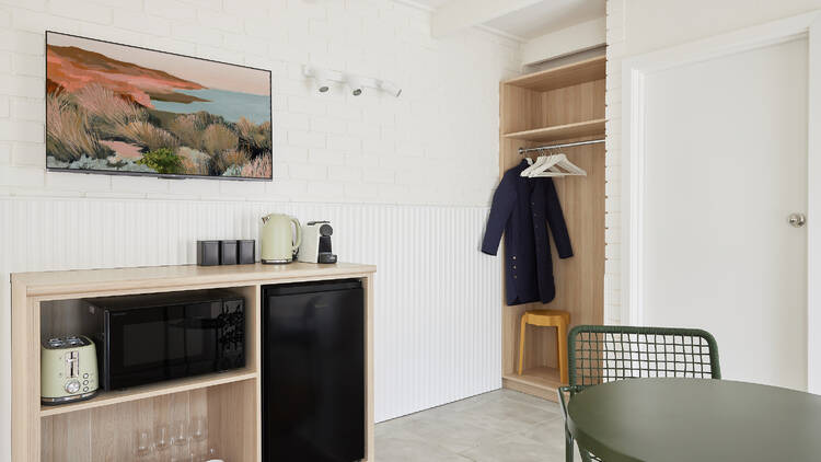 A kitchenette and wardrobe area in a room at the Keith Motel.