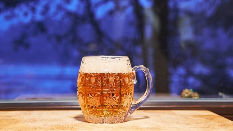 Pint of pilsner on a table top in Europe