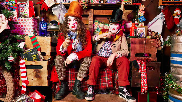 Sh!t Theatre’s Louise Mothersole and Rebecca Biscuit sit in Santa’s workshop