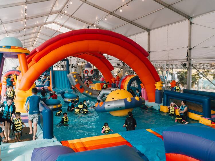 Changi Airport’s new space-themed inflatable waterpark has giant waterslides, obstacle courses, kiddy pools and more