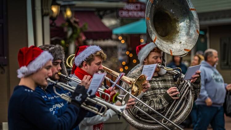 Intercourse, PA - December 3, 2016: A brass quartet performs Christmas tunes for shoppers at the Kitchen Kettle.