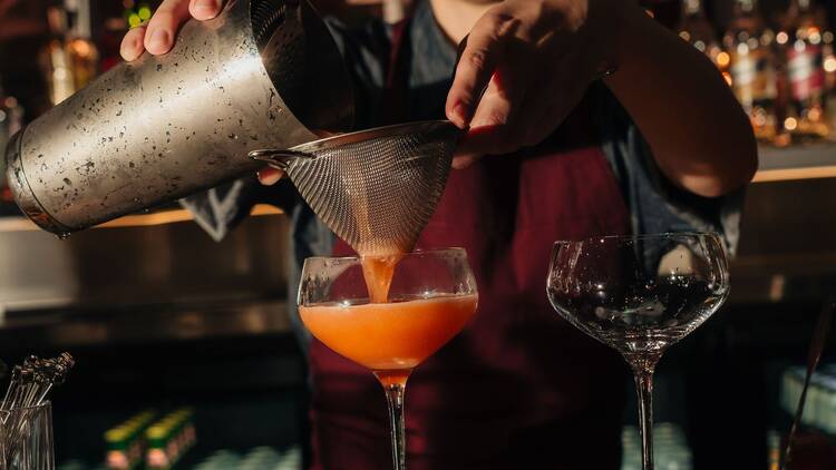 Bartender mixing cocktails.