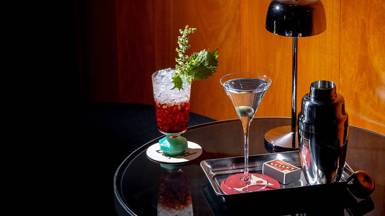 Two cocktails on a black table