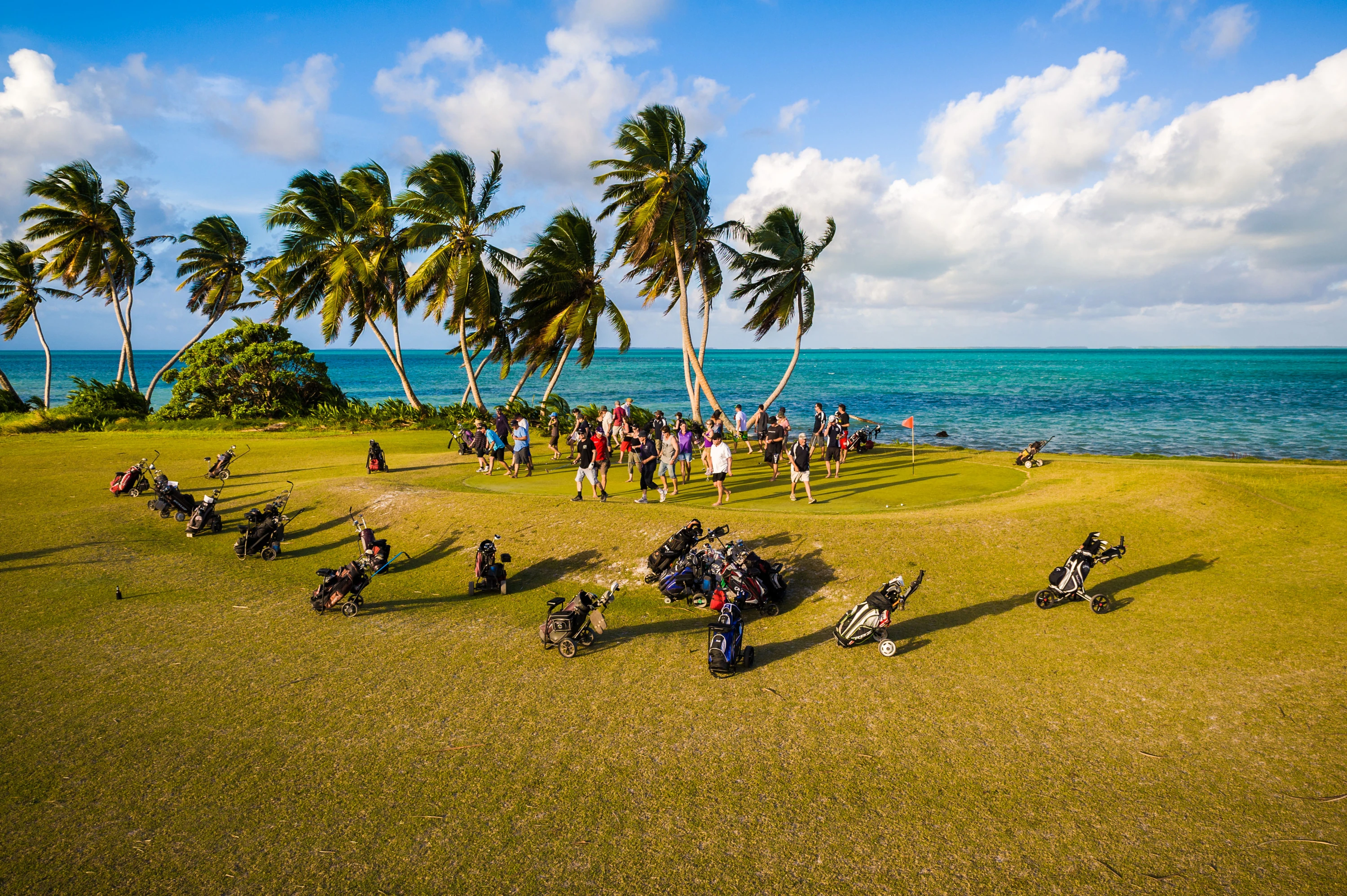 Golf course with golfers on beach