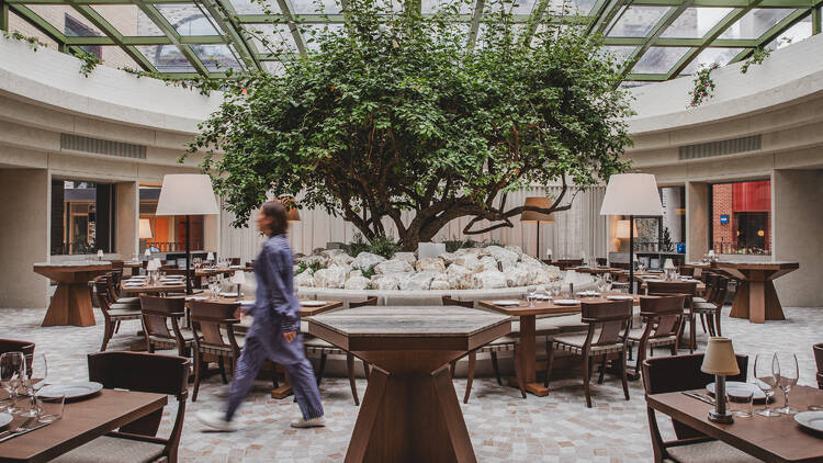 A waiter walking in Olympus