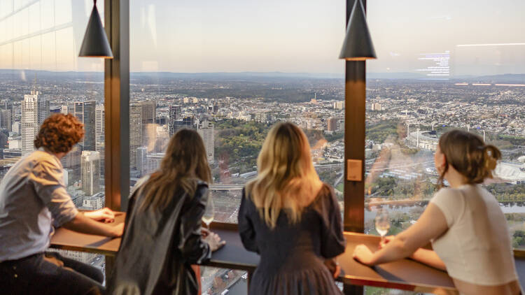 People admiring the view at Melbourne Skydeck.