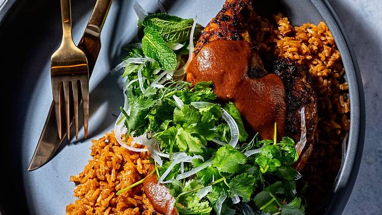 H Street Chicken with berbere spice sauce and jollof rice from Dōgon in Washington, D.C. 