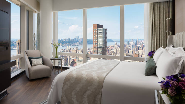 A hotel room with views of the Hudson River.