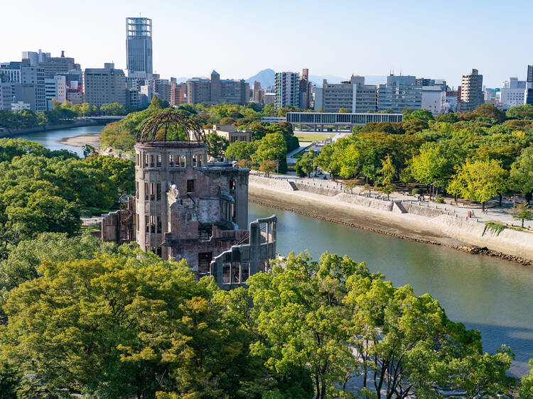 The Atomic Bomb Dome with the Hiroshima Peace Memorial Museum in the distance