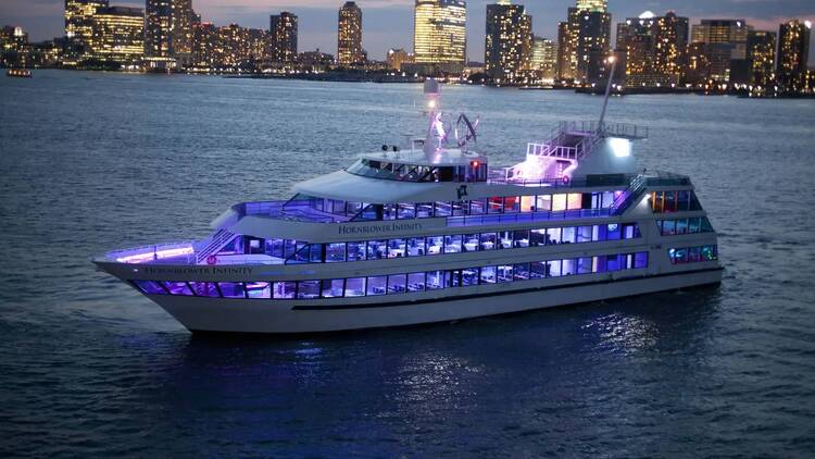 yacht sailing through new york harbor