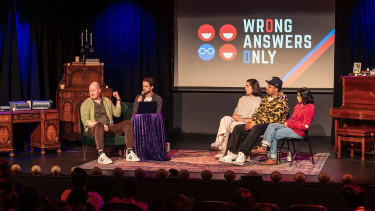 A panel of comedians and scientists at Wrong Answers Only.