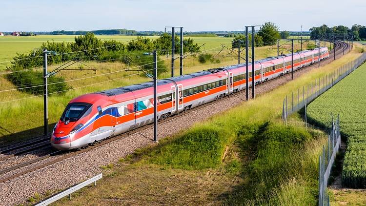 Trenitalia train going through the French countryside