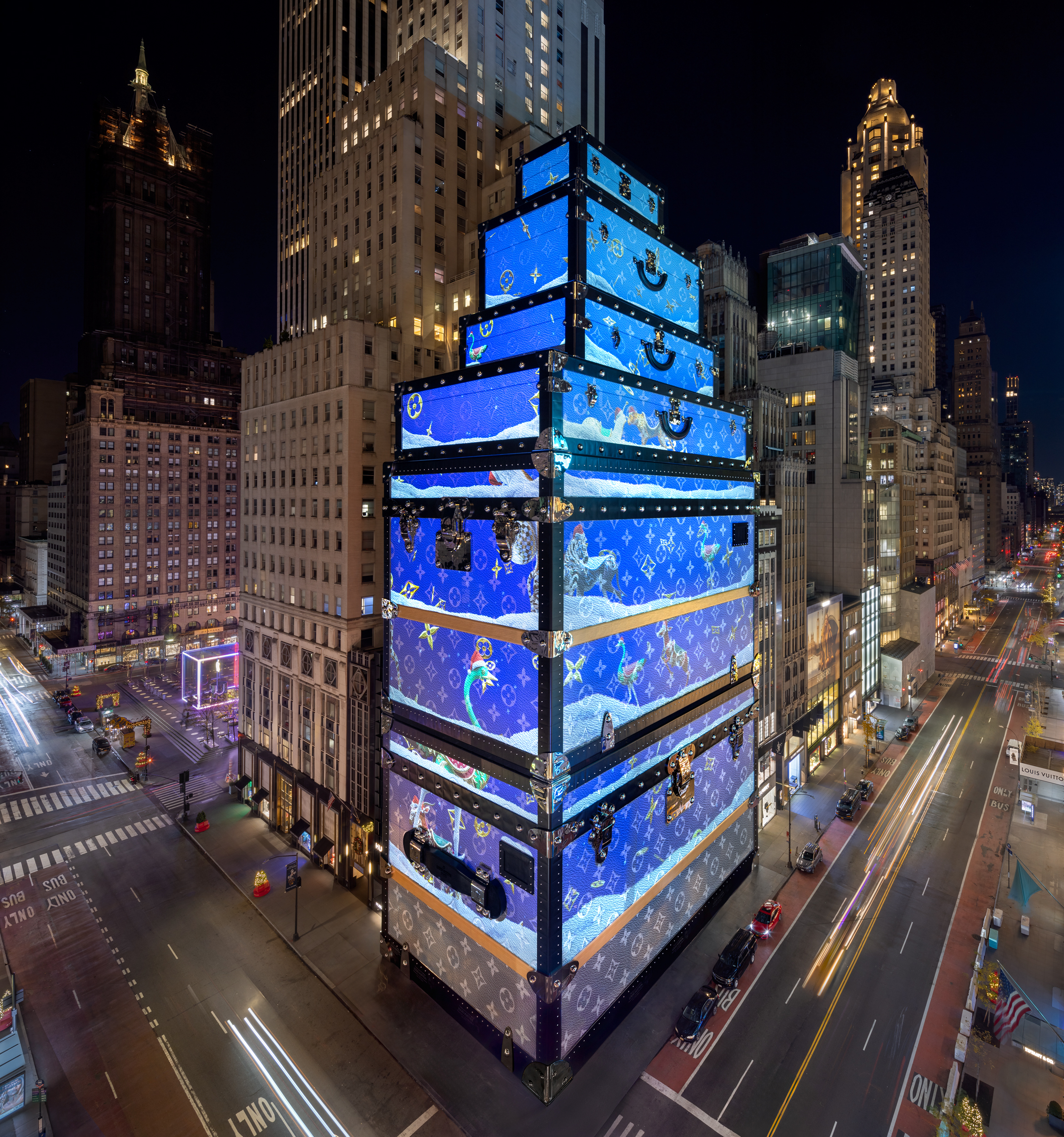 A 240-foot-tall holiday animation takes over the Fifth Avenue Louis Vuitton store every half hour