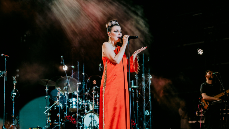 Tina Arena performs live in a red gown, 2024