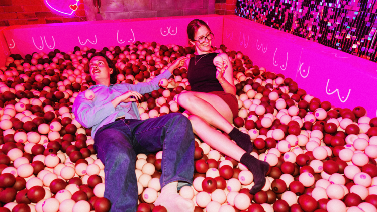 Two people in a ball pit