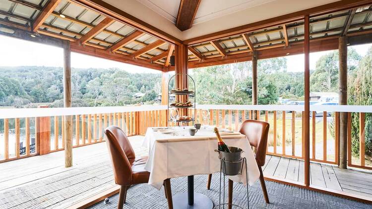 A table in a restaurant overlooking a dam