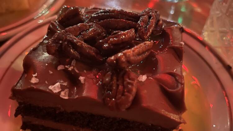 A chocolate slice from a sheet cake