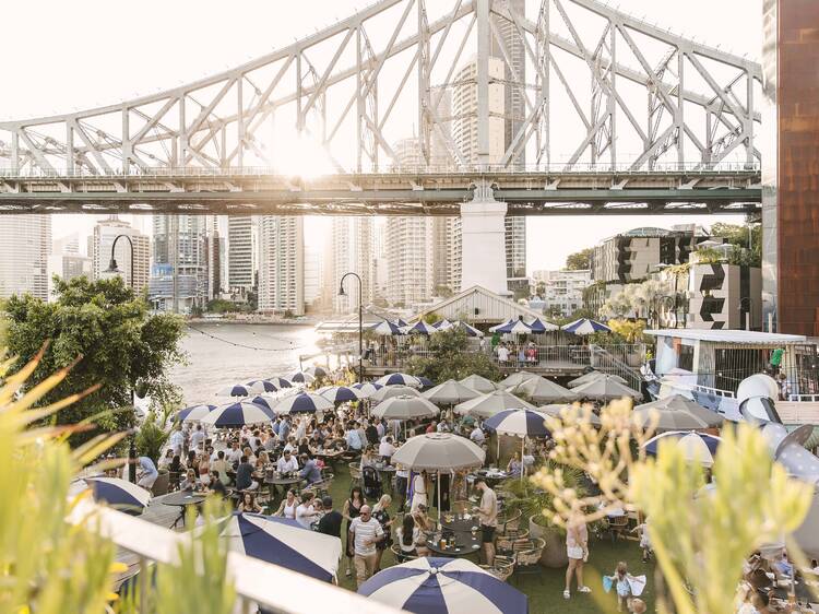 Outdoor beer garden under bridge