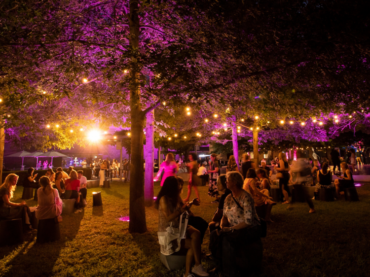 A crowd at NGV Friday Nights in the garden