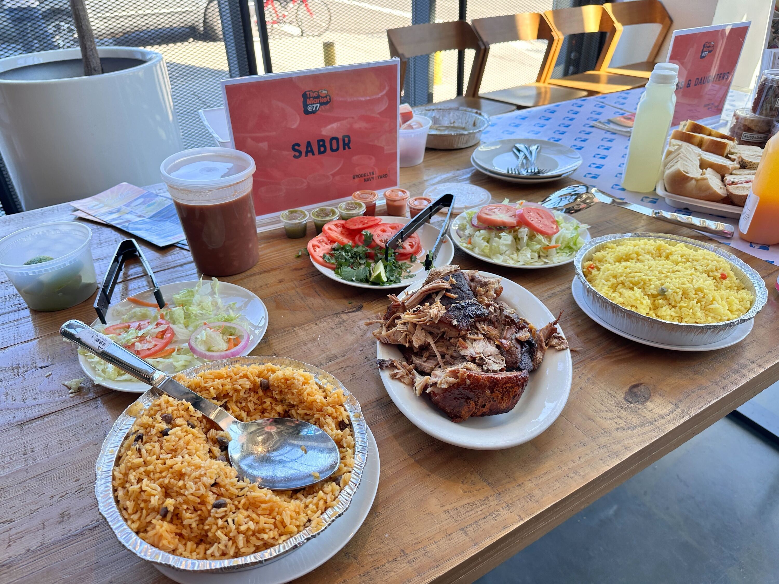 A spread of rice, pernil and Sabor products