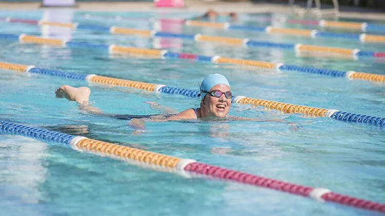 A person swimming in a pool.