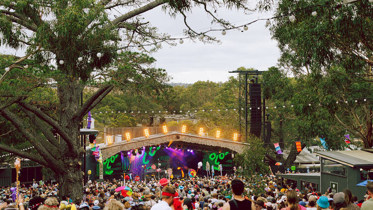 A crowd in front of a stage. 