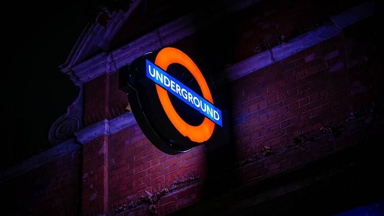 London Underground sign in the dark