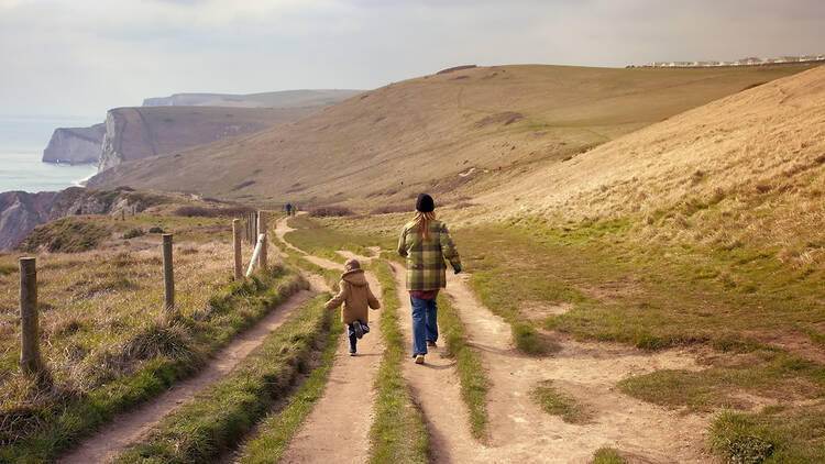 Mother and child on a coastal walk in Kent, England