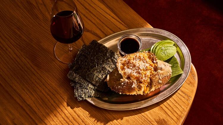 The Dungness Crab on a table with a glass of red wine