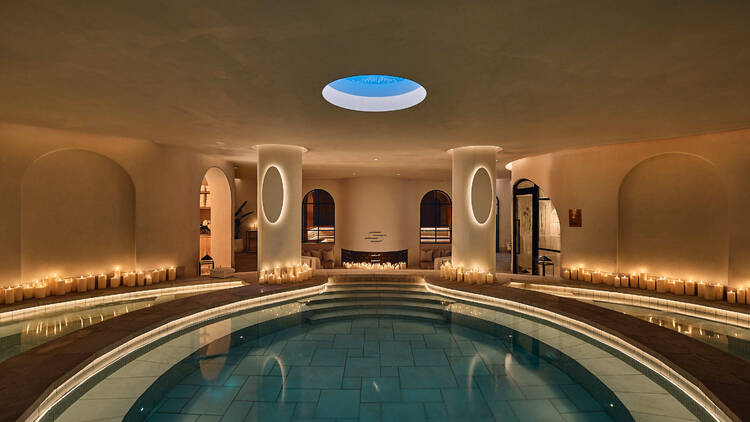 An indoor bathhouse with candles.