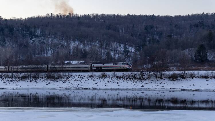 an Amtrak train in New York with snow