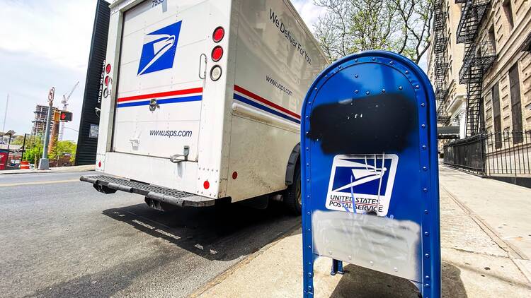 A USPS truck and box in New York.