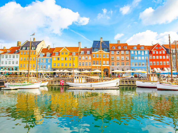 Copenhagen, Denmark - 12 April, 2021: Panoramic view of Nyhavn harbour in Copenhagen old town, danish capital